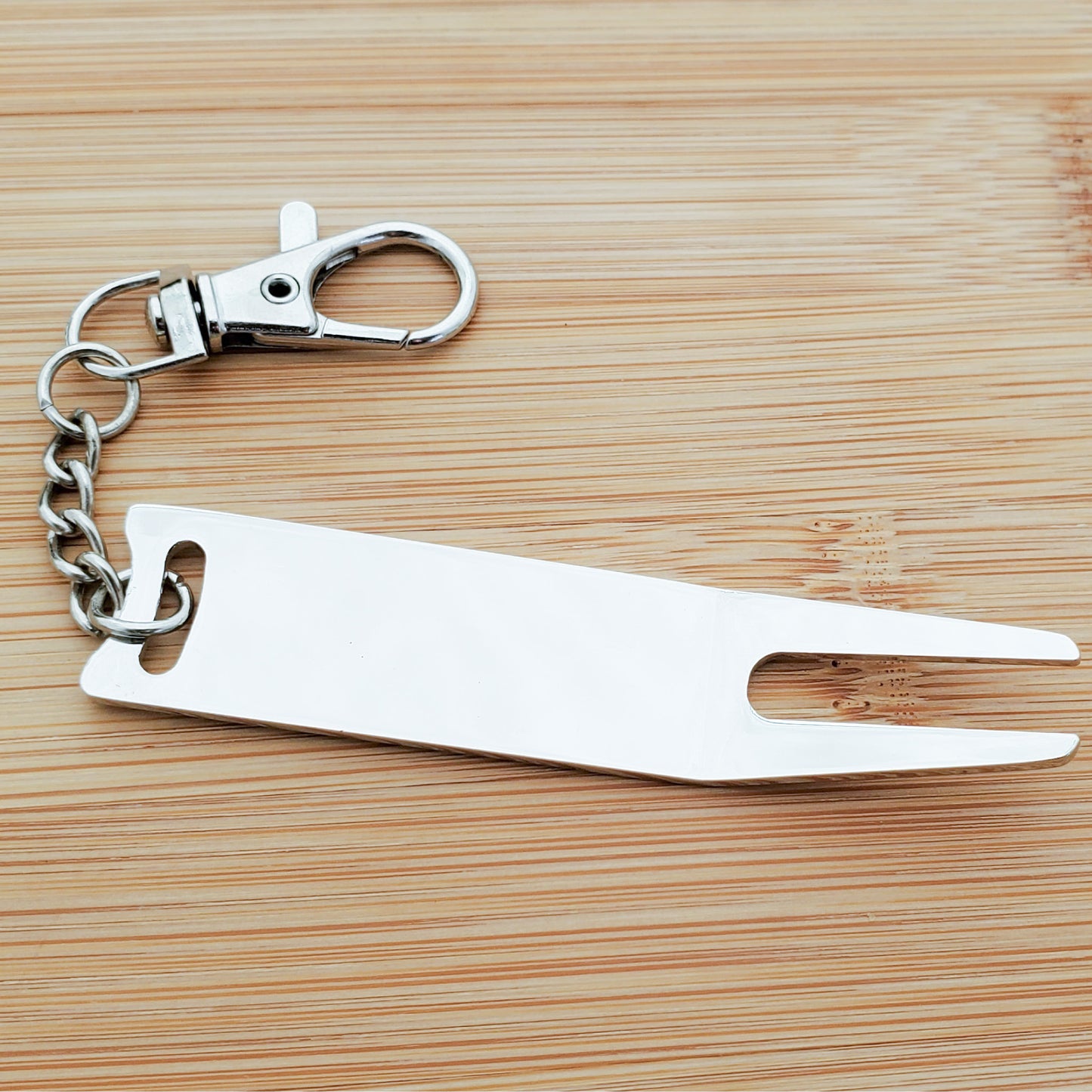 A CUSTOM ENGRAVED DIVOT FIXER