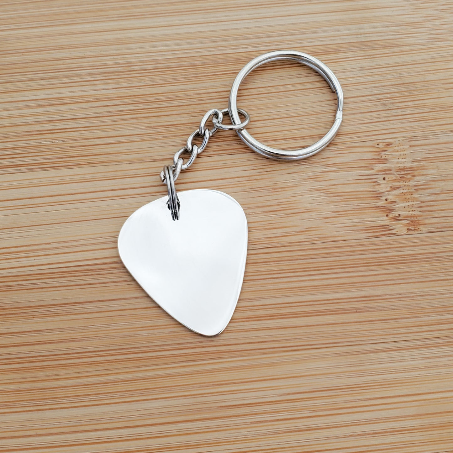 A CUSTOM ENGRAVED PICK KEYCHAIN