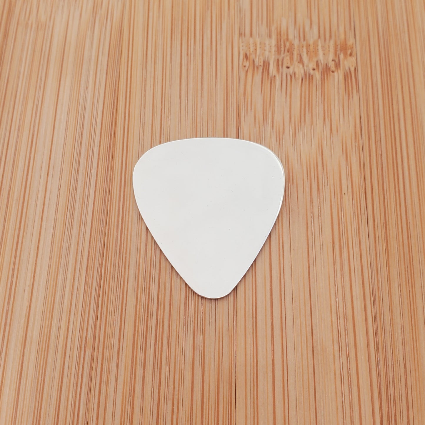 A CUSTOM ENGRAVED GUITAR PICK