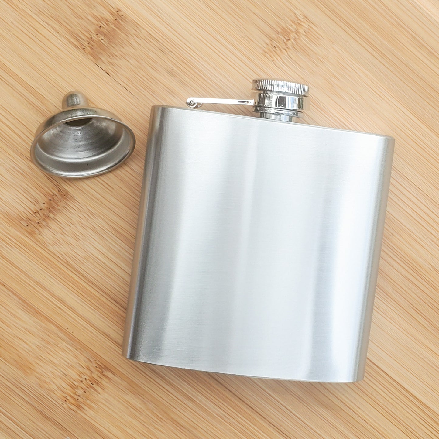 A CUSTOM ENGRAVED FLASK